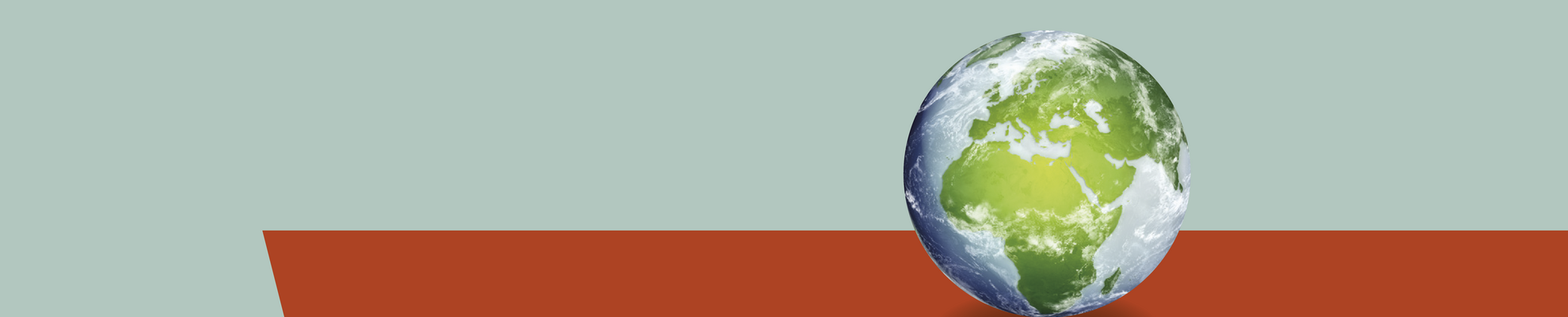 Bild Weltkugel vor grau-orangefarbenem Hintergrund