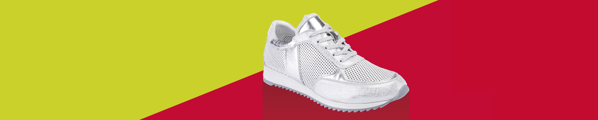Bild Turnschuh vor gelb-rotem Hintergrund